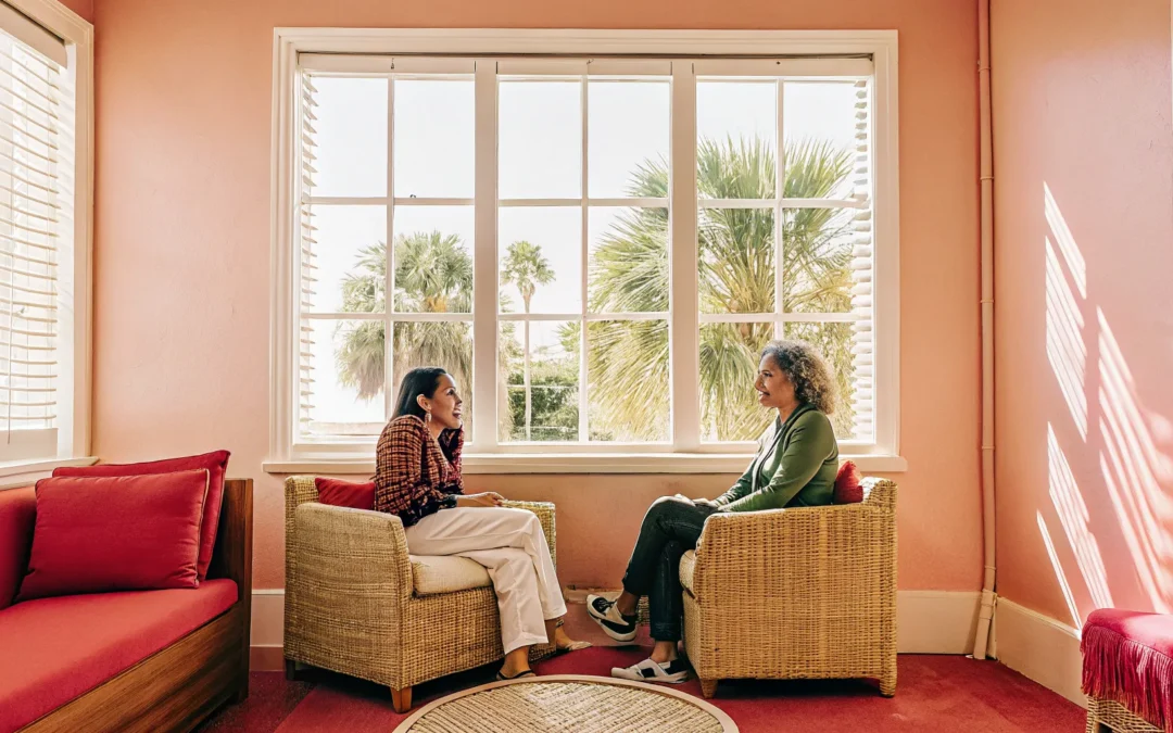 Therapist speaking with a client in a bright Sarasota counseling office