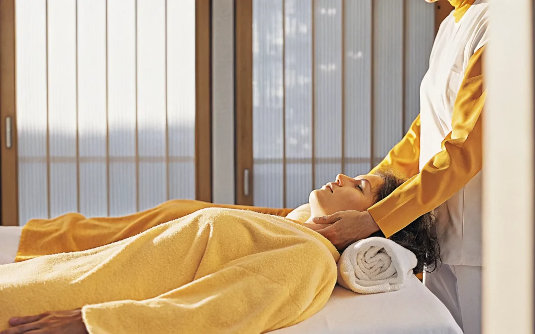 A serene spa-like treatment room with soft natural light, highlighting CranioSacral Therapy